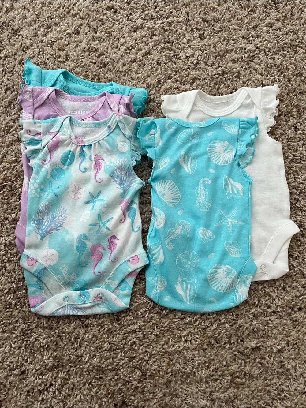 The Children’s Place Newborn 5 Bodysuits & 3 Shorts Set in Pastel Seashell Print